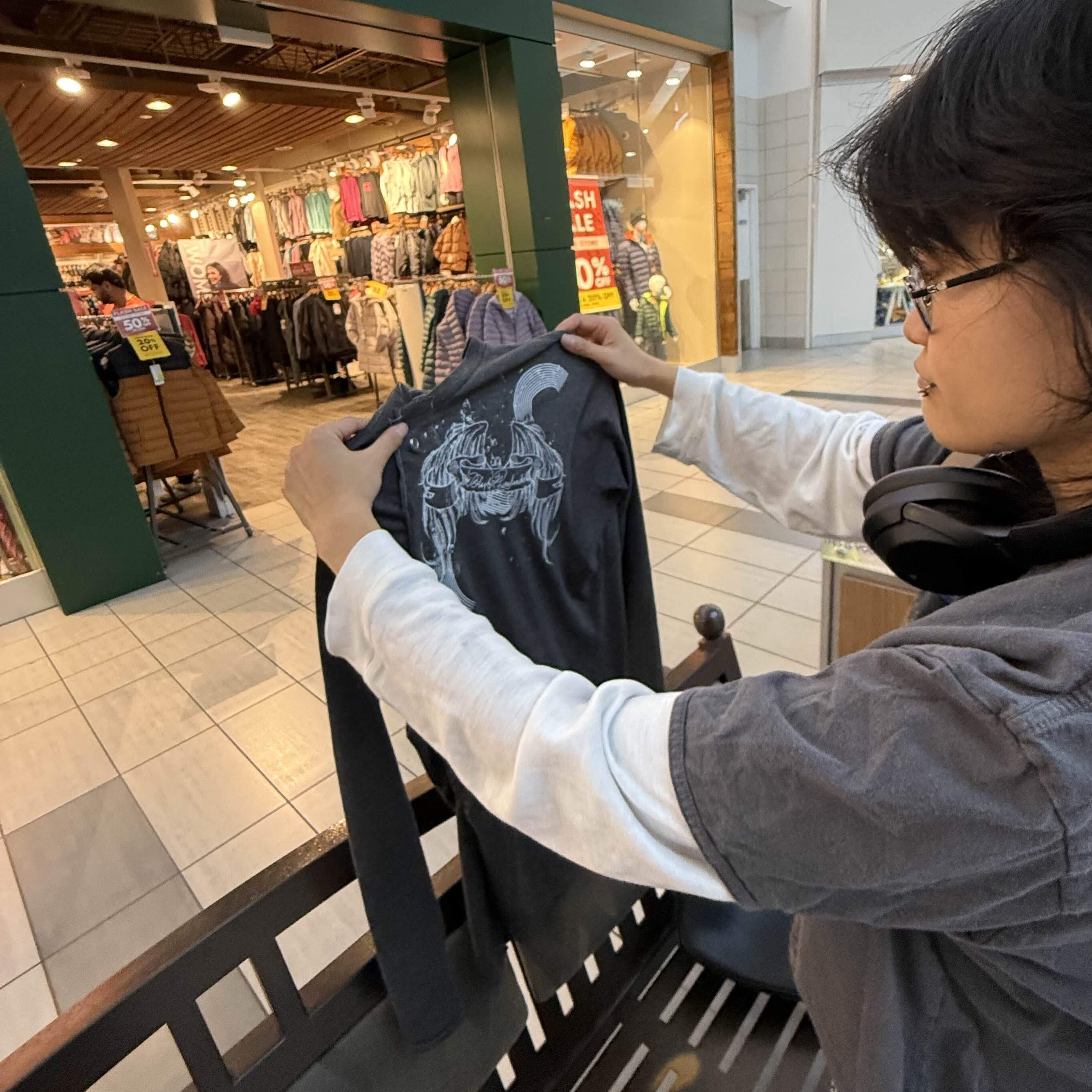 shayuu holding a piece of clothing