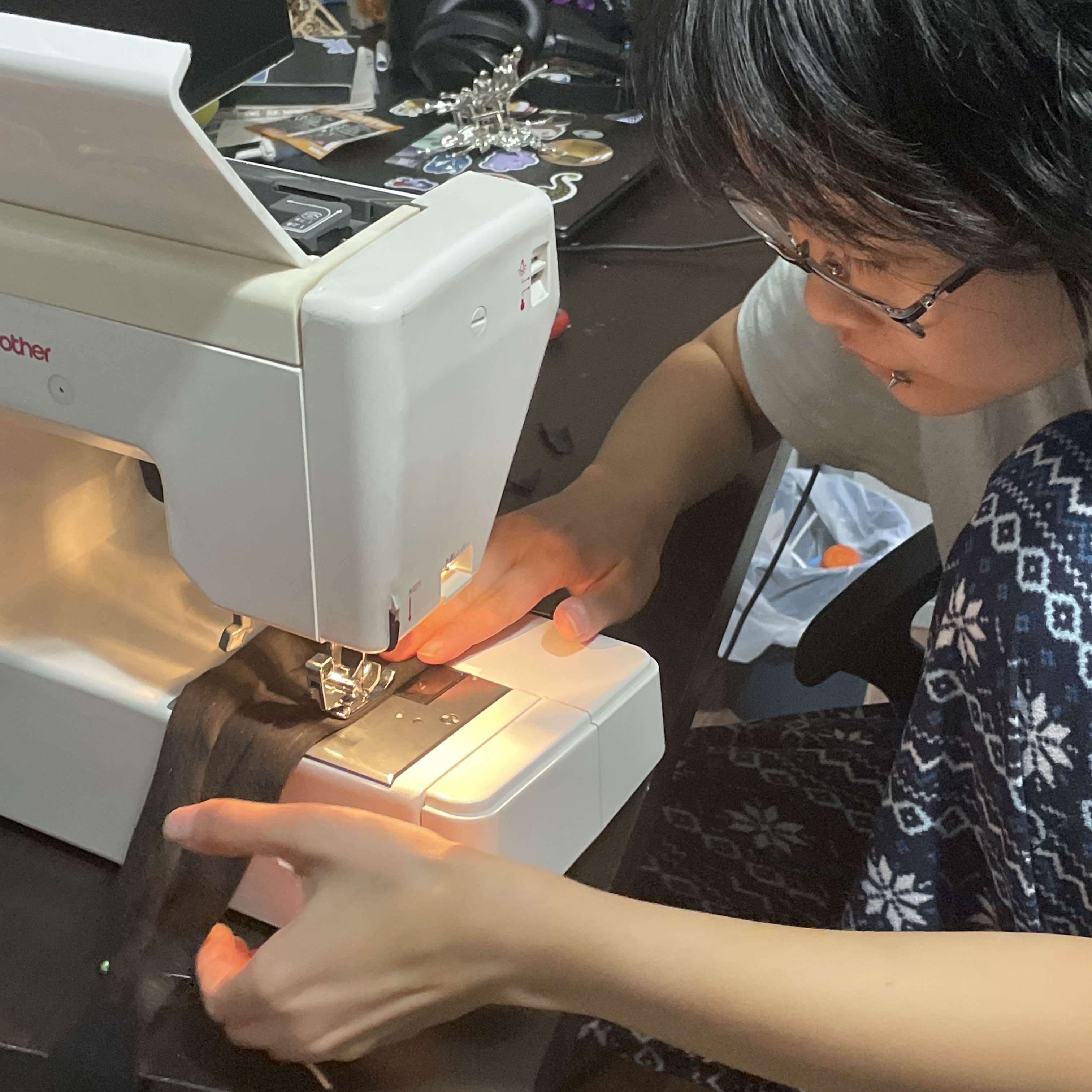 image of shayuu using a sewing machine